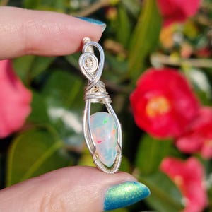 Ethiopian welo opal wire wrapped crystal pendant