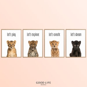 May include: Four framed prints with images of baby animals and text. The prints feature a lion cub, a leopard cub, a cheetah cub, and a black panther cub. The text on the prints reads "Let's play", "Let's explore", "Let's create", and "Let's dream".