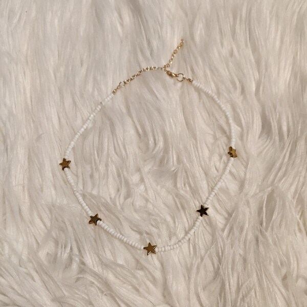 White Beaded Necklace With Gold-Color Stars