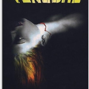 May include: Movie poster for Dario Argento's "Tenebre." The title is in yellow, stylized text. The image features a person's face, with a wound on the neck. The hair is a mix of yellow, orange, and red. The background is dark.