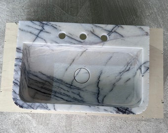 Lavabo de mármol lila para baño.