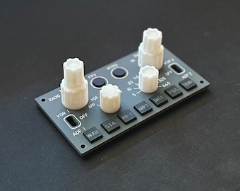 May include: A gray panel with black buttons and white knobs. The buttons are labeled "RADIO", "VOR I", "ADF I", "WXR", "STA", "WPT", "ARPT", "DATA", "POS", "ADF 2", and "TER". The knobs are labeled "FPV", "VOR", "APP", and "MINS".