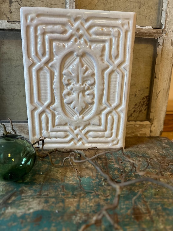 Old antique stove crown, shabby vintage stove tile