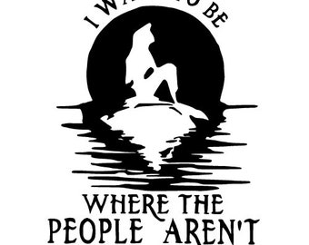 May include: A black and white graphic decal featuring a silhouette of a mermaid sitting on a rock against a large circular moon. The text I WANT TO BE WHERE THE PEOPLE AREN'T is printed in a stylized font above and below the central image.
