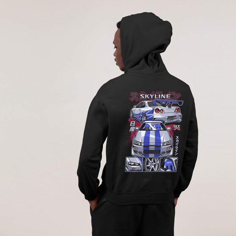 May include: Black hoodie with a white and blue illustration of a Nissan Skyline GT-R on the back. The illustration includes Japanese text that says "Skyline" and "GT-R".