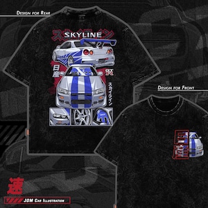 May include: Black t-shirt with a white and blue illustration of a Nissan Skyline GT-R car. The design includes Japanese text and the words "Skyline" and "GT-R".