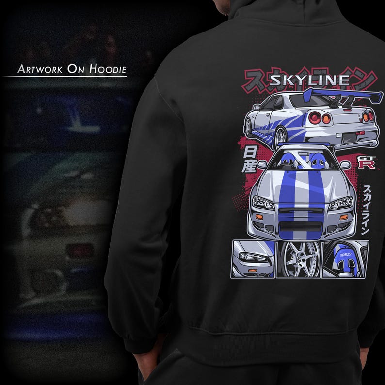 May include: Black hoodie with a white and blue graphic of two Nissan Skyline GT-R cars. The graphic includes Japanese text that says "Skyline" and "GT-R".