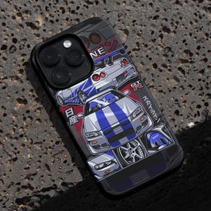 May include: A black phone case with a white and blue graphic of a Nissan Skyline GT-R. The graphic features the Japanese text "Initial D" and "GT-R".