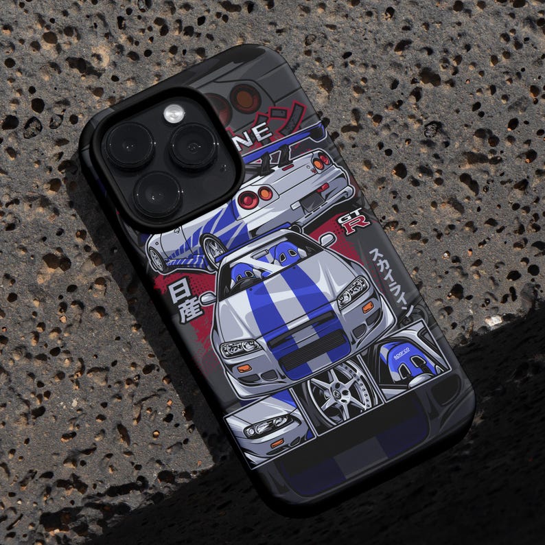 May include: A black phone case with a white and blue graphic of a Nissan Skyline GT-R. The graphic features the Japanese text "Initial D" and "GT-R".