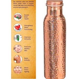 May include: A copper water bottle with a hammered texture and a screw-on lid. The bottle is a warm copper color and has a cylindrical shape. A panel on the left lists six health benefits of drinking water from a copper vessel.