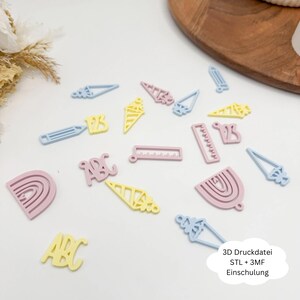 May include: Assorted pastel-colored 3D-printed shapes, including pencils, ice cream cones, rulers, letters, and rainbows. The shapes are in light blue, pink, and yellow. The shapes are scattered on a white surface.