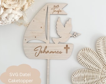 May include: Wooden cake topper with a sailboat, dove, and cross. The topper is engraved with the text "zur Taufe" and "Johannes".