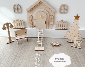 May include: A wooden elf door set with a small house, a ladder, a bench, a fence, a street lamp, a Christmas tree, a sled, and footprints. The set is made of unfinished wood and has a rustic charm.