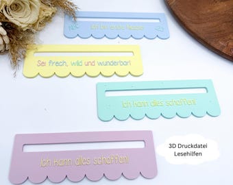 Könnte beinhalten: Vier farbige Lesehilfen in Pastelltönen von Blau, Gelb, Grün und Rosa. Jede hat einen gewellten Rand und eine rechteckige Öffnung. Auf jeder Hilfe ist deutscher Text aufgedruckt, mit Sätzen wie "Ich kann alles schaffen!"