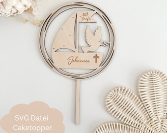 May include: A wooden cake topper with a sailboat, dove, and cross. The topper is decorated with the text "zur Taufe" and "Johannes".