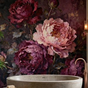 May include: A bathroom with a large, oval stone bathtub. The wall features a floral mural of deep pink and burgundy peonies. A wooden ladder with towels and a small wooden stool create a spa-like atmosphere. The room has a rustic feel.