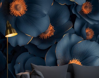 May include: A dark blue couch with two pillows in front of a wall with a large floral pattern. The flowers are dark blue with orange centers and have a gold outline.