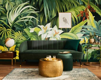May include: A green velvet sofa with a gold metal coffee table and a green velvet ottoman in front of a tropical mural with white flowers and a bird illustration.