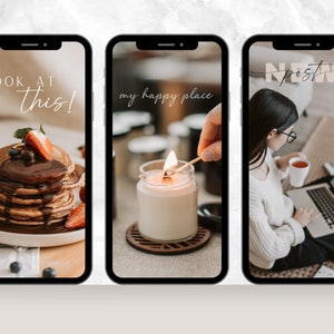 May include: Three images on a phone screen. The first image shows a stack of pancakes with chocolate sauce, blueberries, and strawberries. The text "LOOK AT this!" is on the screen. The second image shows a lit candle in a glass jar on a wooden coaster. The text "my happy place" is on the screen. The third image shows a person sitting on the floor with a laptop and a cup of tea. The text "new post" is on the screen.