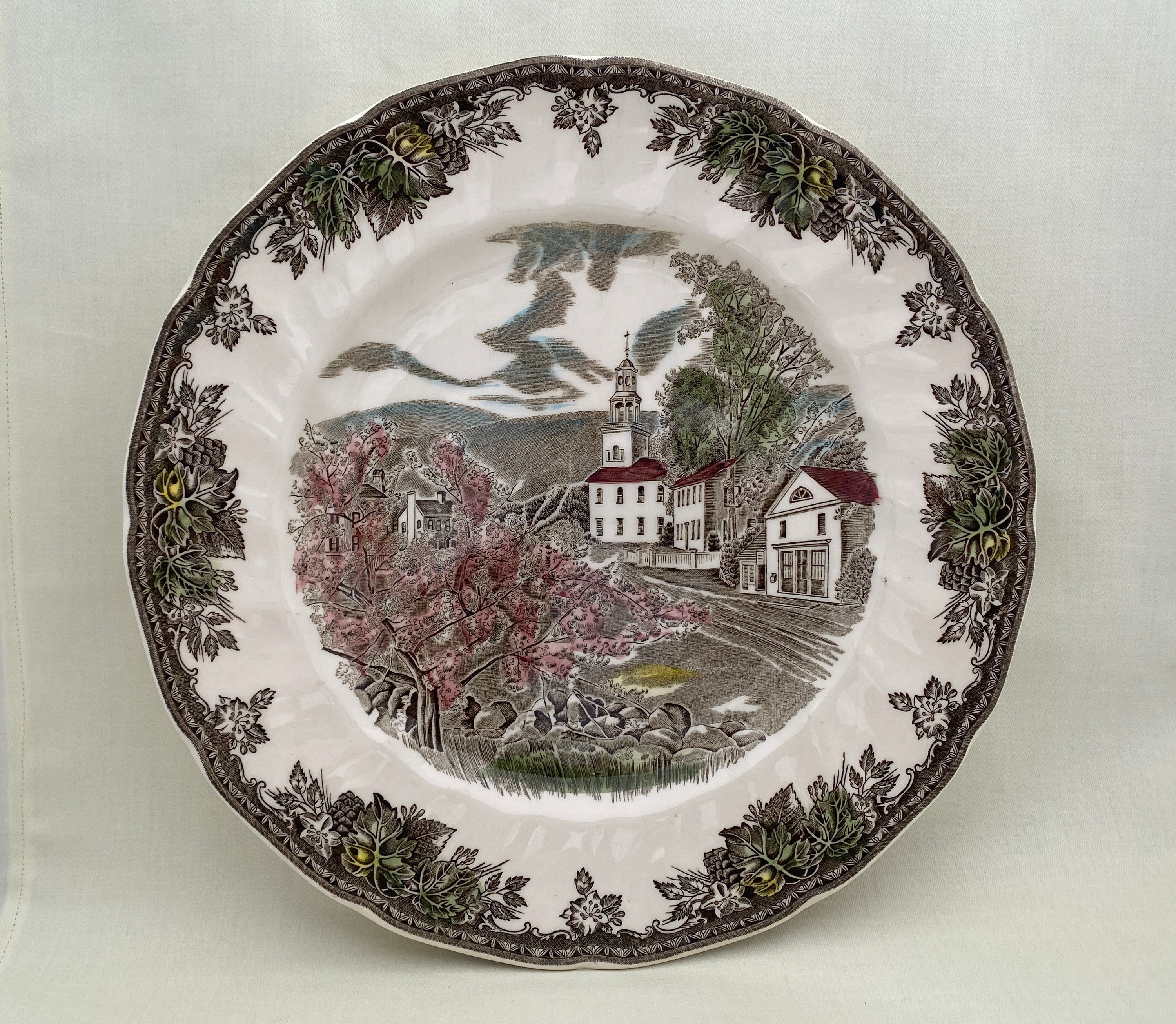 Johnson Brothers The Friendly Village - The Village Green dinner plate with design of small village with blossoming tree - made in England