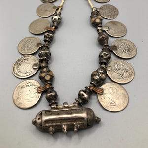 Antique silver tribal necklace with amulet and coins