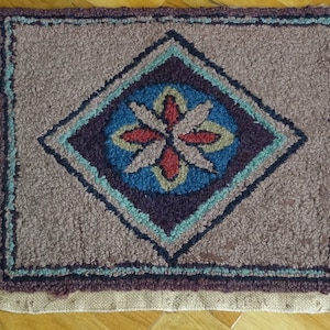 Antique hooked rug as chair seat, signed