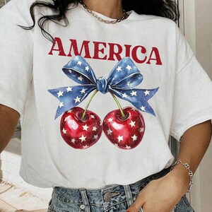 Camisa con lazo Comfort Colors America Cherries, camisa America Cherries del 4 de julio, camisa patriótica para mujer, camisa femenina del 4 de julio, camiseta con la bandera de EE. UU.