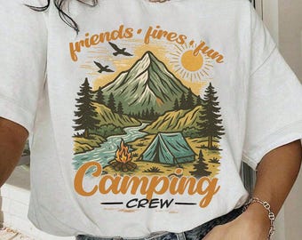 May include: White t-shirt with a camping graphic. The design includes a mountain, river, tent, campfire, and the words "friends, fires, fun" and "Camping Crew" in orange and black.