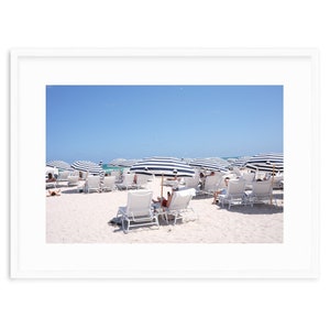 Chic Striped Sunshades and Lounge Chairs on Pristine Miami Beach Sands