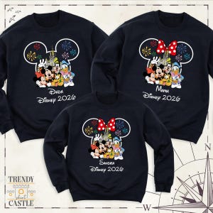 May include: Three navy blue crewneck sweatshirts featuring a white Mickey Mouse head outline filled with Disney characters, fireworks, and a castle. Each shirt displays custom text including names like Dada, Mama, or Sandra and Disney 2026.