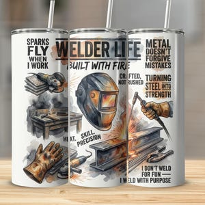 May include: A white stainless steel travel mug with a design featuring welding tools, a welding helmet, and the text "Welder Life." The mug includes the phrases "Sparks Fly When I Work" and "Metal Doesn't Forgive Mistakes."