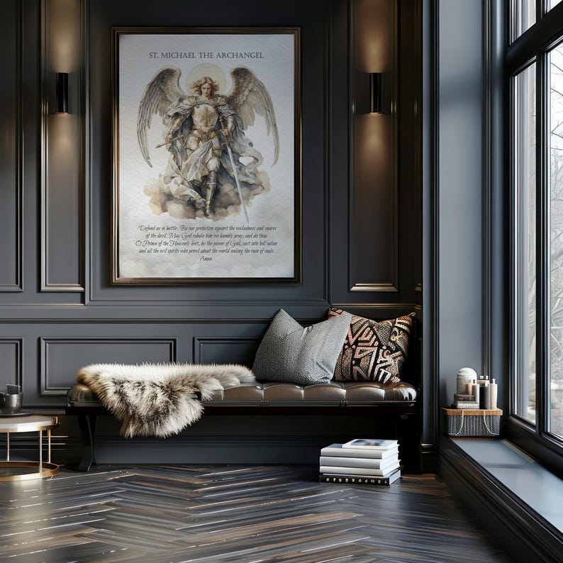 May include: A framed print of St. Michael the Archangel hangs on a dark gray wall. The artwork depicts the angel with wings, holding a sword. Below the image is a passage of text. A bench with pillows and a faux fur throw sits below the artwork.