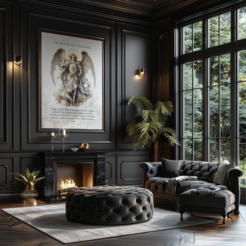 May include: A luxurious living room with dark walls, a large framed artwork, and a tufted ottoman. The room features a fireplace, a sofa, and a large window with a view of trees. The artwork is of St. Michael the Archangel.