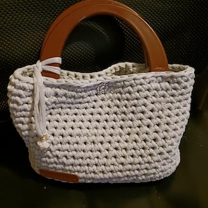 Elegant crochet bag with plastic handles