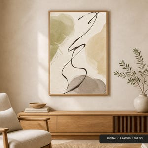 Peut inclure: Une impression d'art mural rectangulaire dans un cadre en bois présentant des formes abstraites à l'aquarelle dans des tons vert olive, beige et gris doux, superposées d'une ligne d'encre noire continue. L'œuvre est exposée sur un mur.