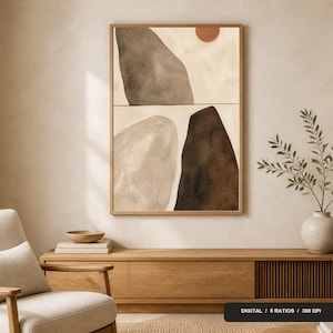 Peut inclure: Une impression d'art mural rectangulaire encadrée présentant une composition abstraite de grandes formes organiques dans des tons brun foncé, gris et beige, accentuée par un petit cercle terre cuite, avec le texte DIGITAL / 5 RATIOS / 300 DPI en bas.