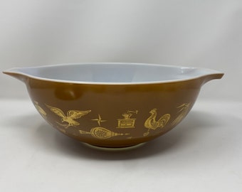 Pyrex Early American 4qt Cinderella bowl. Preowned w/o chips or cracks. 24k gold on brown background. Labeled 444 years n bottom.