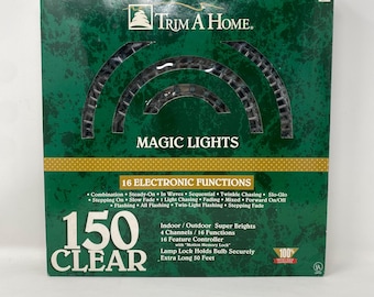 Vintage 1996 Trim A Home 150 Clear “Magic Lights”. 16 Electronic Functions With Memory Lock. Preowned in Working Condition.