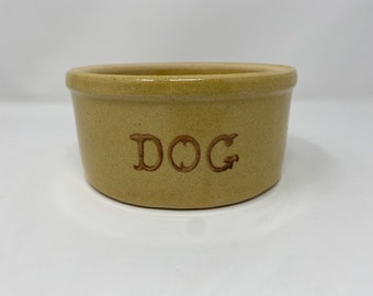 Vintage R. R. P. Co Roseville pottery dog bowl. Circa 1930s-1940s. Tan with “Dog” on front. No chips/cracks. Crazing noted as seen in pics.