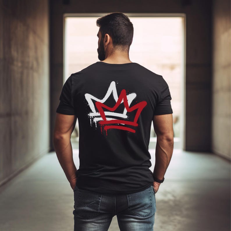 May include: A black t-shirt with a white and red crown graphic on the back. The crown is stylized with a dripping paint effect.