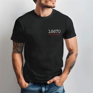 May include: A black t-shirt with white text that reads "16670 ORA PRO NOBIS".