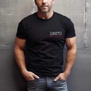 May include: A black t-shirt with white text that reads "16670 ORA PRO NOBIS".