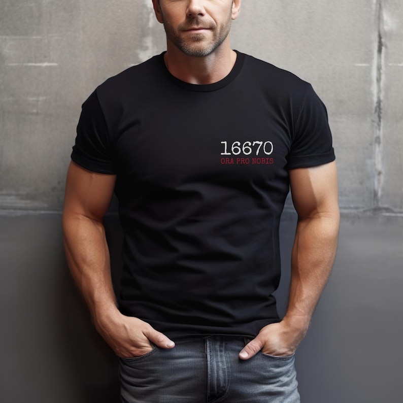 May include: A black t-shirt with white text that reads "16670 ORA PRO NOBIS".