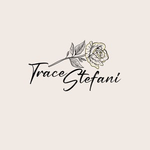 May include: A floral logo design featuring a rose with black line art and gold accents. The text "Trace Stefani" is written in elegant script below the flower. The background is a soft, neutral beige.