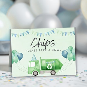 May include: A party sign with the word "Chips" in elegant script. Below, it reads "PLEASE TAKE A BOWL." A green garbage truck illustration is decorated with a recycling symbol and party hat. Balloons in shades of blue and green complete the design.