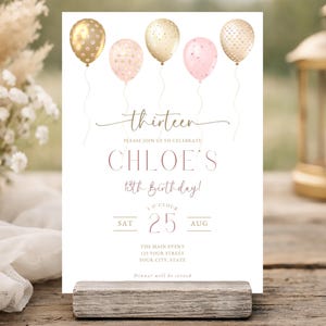 May include: A rectangular birthday invitation card featuring five balloons in gold, cream, and pink with polka dot patterns. The text reads thirteen, PLEASE JOIN US TO CELEBRATE CHLOE'S 13th Birthday!, 5 O'CLOCK, SAT 25 AUG, THE MAIN EVENT, 123 YOUR STREET, YOUR CITY, STATE, Dinner will be served.