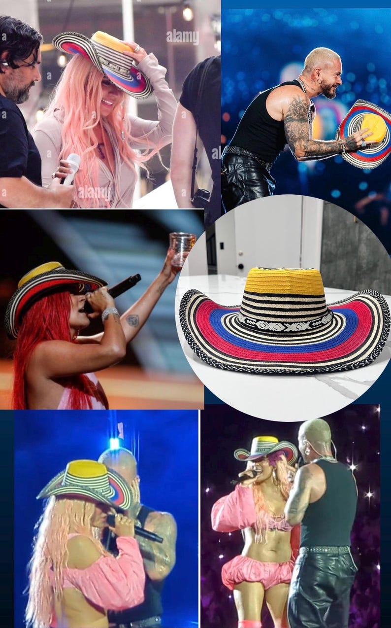 May include: A wide-brimmed hat featuring a yellow crown, a black and white striped band, and a multi-colored brim with concentric rings of red, blue, and black. The hat has a woven texture and a distinct geometric pattern around the base of the crown.