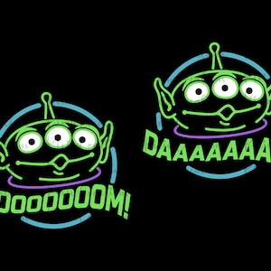 May include: Green alien character with three eyes and a big smile in a neon blue circle with the text "MOOOOOM!" in green.