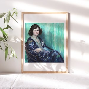 May include: A framed painting of a woman wearing a blue and floral patterned robe, sitting in a chair against a teal background.