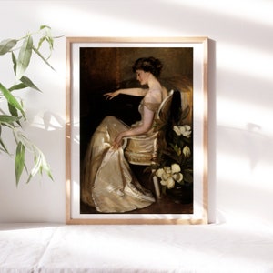 May include: A painting of a woman in a white dress sitting in a chair. She is surrounded by white flowers. The painting is in a wooden frame.